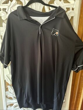 Antigua Black Philadelphia Flyers Polo with Team Logo